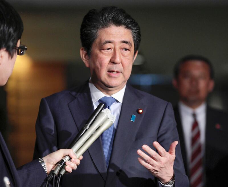 Japanese Prime Minister Shinzo Abe speaks to journalists at at Prime Minister's office Friday, April 27, 2018, in Tokyo. Abe praised the talks Friday as a "forward-looking move." He told reporters in Tokyo that he expects North Korea to take concrete actions toward denuclearization through its planned talks with the U.S. (Shin Kigeuchi/Kyodo News via AP)