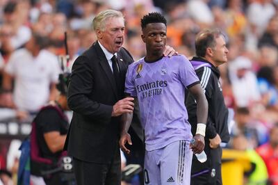 Real Madrid manager Carlo Ancelotti talks to Vinicius Junior during the game against Valencia. Getty