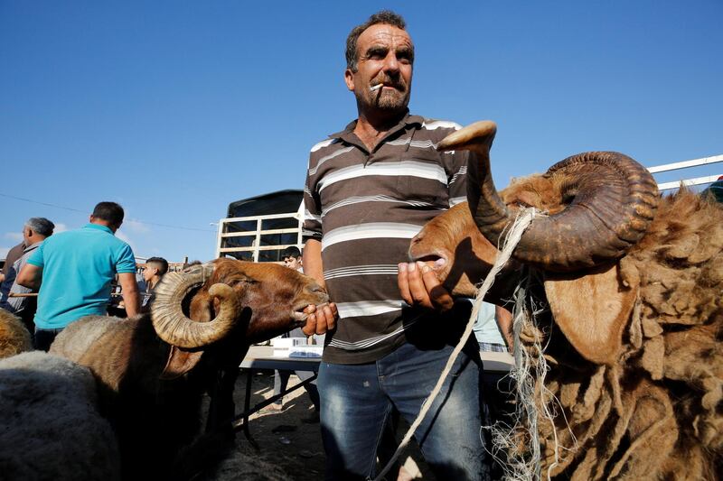 A Palestinian man waits for customers in Nablus. EPA