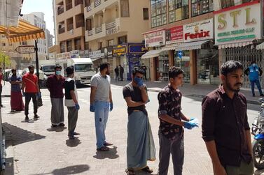 Residents line up for testing for Covid-19 as volutneers lend a hand in the Al Ras neighbourhood that is shut down to slow the spread of the coronavirus. Courtesy: Al Ras residents