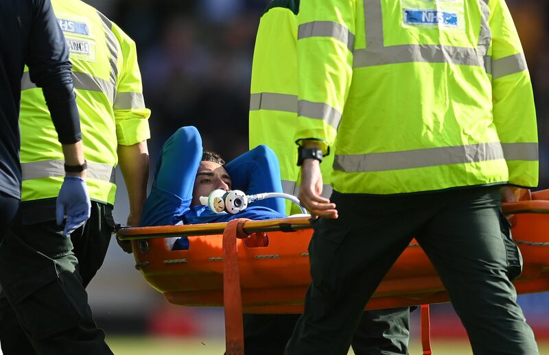 LIVERPOOL, ENGLAND - AUGUST 06: Ben Godfrey of Everton is stretchered off the pitch after receiving medical treatment during the Premier League match between Everton FC and Chelsea FC at Goodison Park on August 06, 2022 in Liverpool, England. (Photo by Michael Regan / Getty Images)