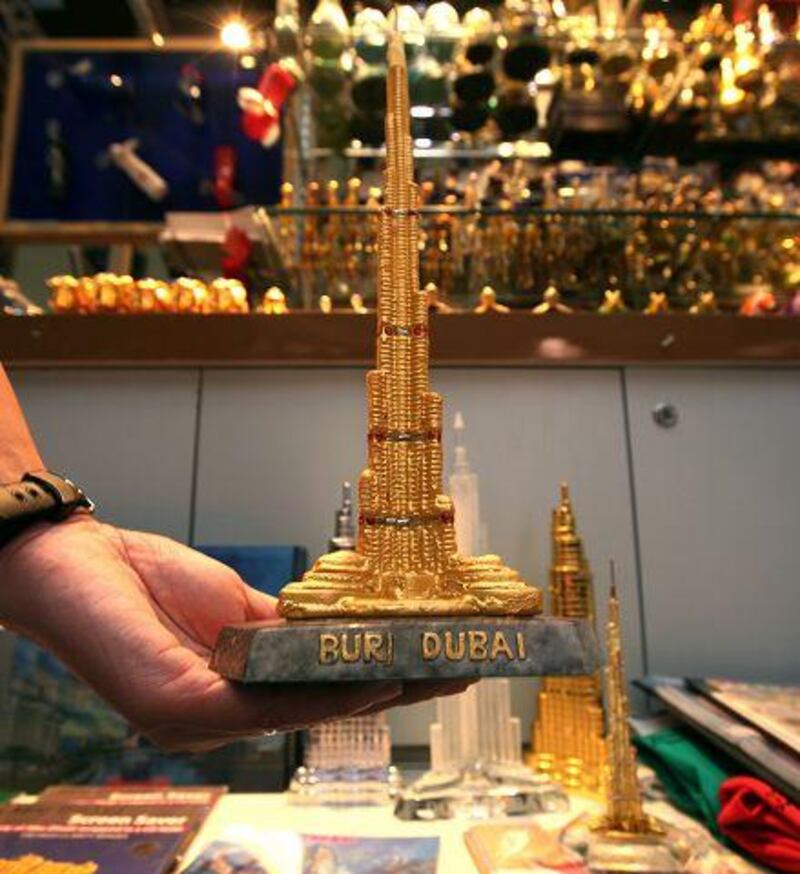 Souvenirs with the outdated Burj Dubai name are selling at a discount as traders await new stock. Paulo Vecina / The National
