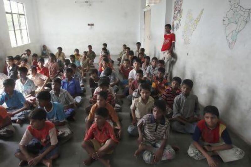 Children watch television at an orphanage in Hyderabad. Child abuse is still common in India, despite efforts to stamp it out.