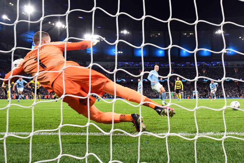 Erling Haaland scores from the penalty spot as Manchester City take the lead against Young Boys. AFP