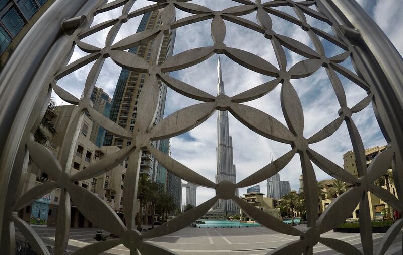 DUBAI, UNITED ARAB EMIRATES , April 06– 2020 :- View of the Burj Khalifa without any visitors in Downtown Dubai in Dubai. Dubai is conducting 24 hours sterilisation programme across all areas and communities in the Emirate and told residents to stay at home. UAE government told residents to wear face mask and gloves all the times outside the home. (Pawan Singh / The National) For News/Online/Instagram.