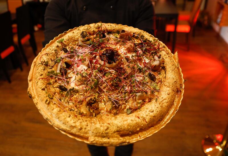 The luxury pizza has met with a mixed reception, with some comments on social media complaining about the price, but others saying it is generating publicity for the restaurant. Reuters