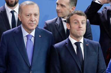 Turkey's President Recep Tayyip Erdogan, left and French President Emmanuel Macron stand, during a group photo at a conference on Libya at the chancellery in Berlin, Germany in January. AP