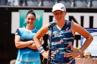 Winner Iga Swiatek (R) of Poland and Ons Jabeur of Tunisia during the trophy ceremony after their women's singles final match at the Italian Open tennis tournament in Rome, Italy, 15 May 2022.   EPA / FABIO FRUSTACI