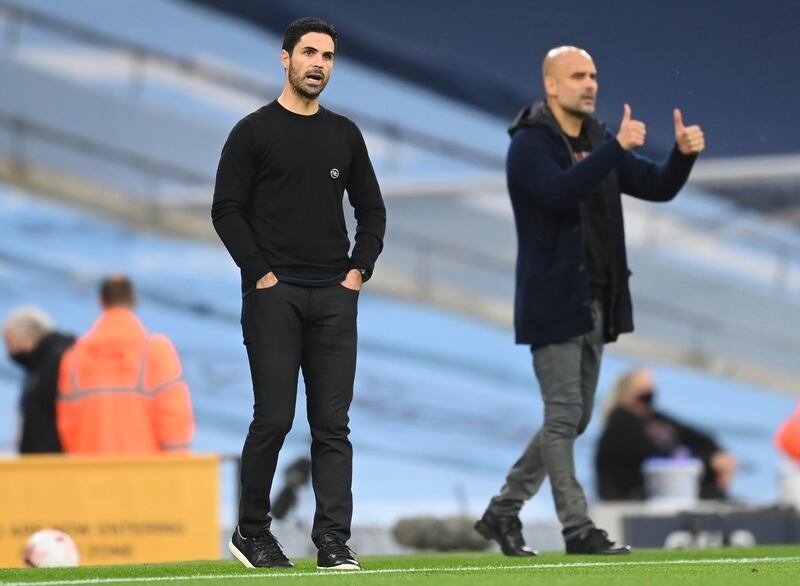 Manchester City manager Pep Guardiola, right, and his Arsenal counterpart Mikel Arteta. EPA