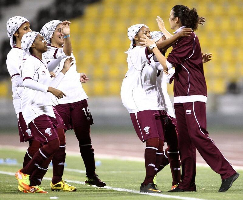 Helena Costa, right, while coach of the Qatar national women's football team. AFP Photo / HO / Qatar Olympic Committee