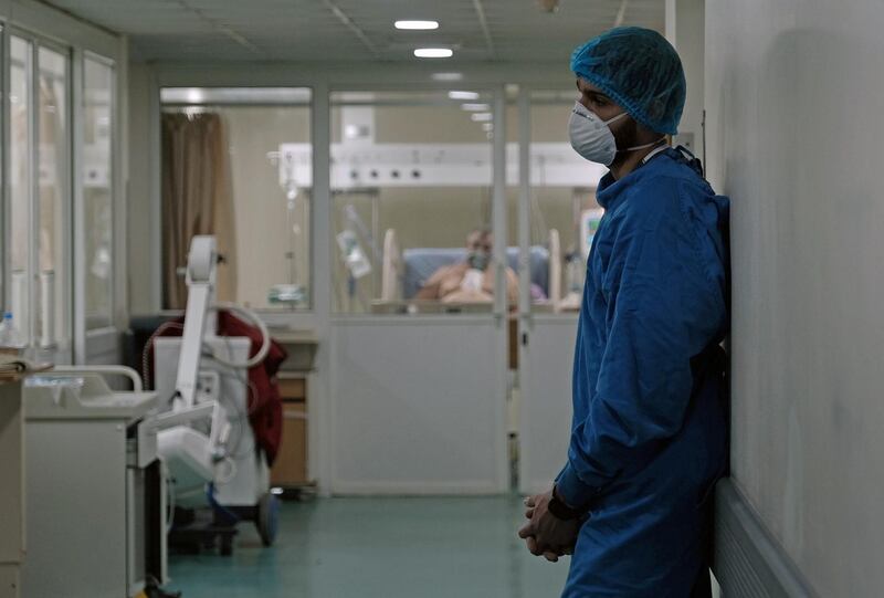 A medical staff member, wearing protective gear, stands at an intensive care unit for patients suffering from the coronavirus disease (COVID-19), at Rafik Hariri University Hospital, in Beirut, Lebanon January 19, 2021. Picture taken January 19, 2021. REUTERS/Emilie Madi.  NO RESALES. NO ARCHIVES