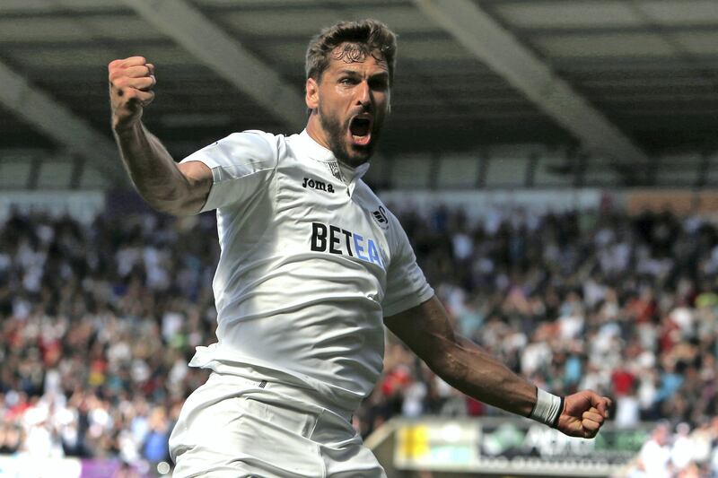 Swansea City's Spanish striker Fernando Llorente celebrates after scoring their second goal during the English Premier League football match between Swansea City and West Bromwich Albion at the Liberty Stadium in Swansea, south Wales on May 21, 2017. / AFP PHOTO / Geoff CADDICK / RESTRICTED TO EDITORIAL USE. No use with unauthorized audio, video, data, fixture lists, club/league logos or 'live' services. Online in-match use limited to 75 images, no video emulation. No use in betting, games or single club/league/player publications.  / 