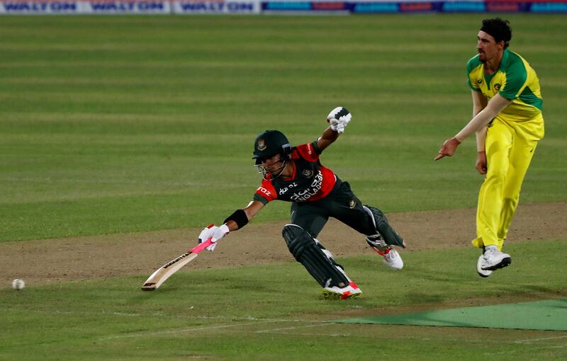 Australia's Mitchell Starc tries to run Bangladesh's Afif Hossain out,
