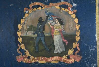 FILE - This undated photo provided by Morphy Auctions shows the 127th Regiment United States Colored Troops battle flag in Denver, Pa. The flag, carried into battle by one of the 11 black Union regiments during the Civil War, was sold at auction to Atlanta History Center on June 13, 2019.  The units were segregated, and commanded by white officers. Estimates are that three-fourths of the soldiers were formerly enslaved men.  (Morphy Auctions via AP, File)
