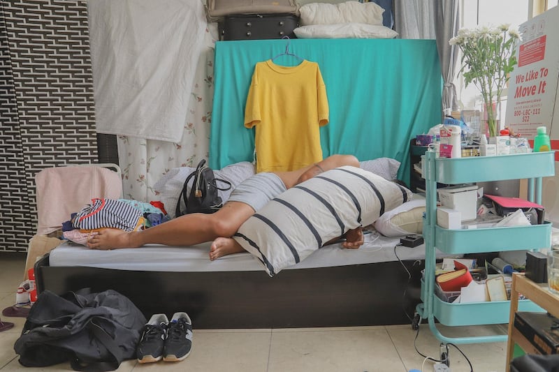 ‘How to Slouch When Sleeping’ is a selfportrait by Augustine Paredes in his bed-space. Courtesy Gulf Photo Plus