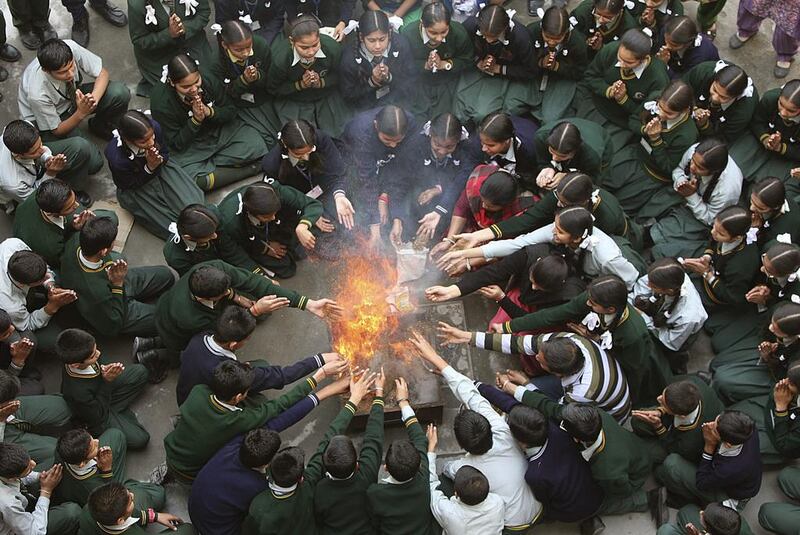 Students attend a prayer ceremony in tribute to the passengers and crew onboard the missing Malaysia Airlines flight MH370, inside a school in Jammu. Mukesh Gupta / Reuters
