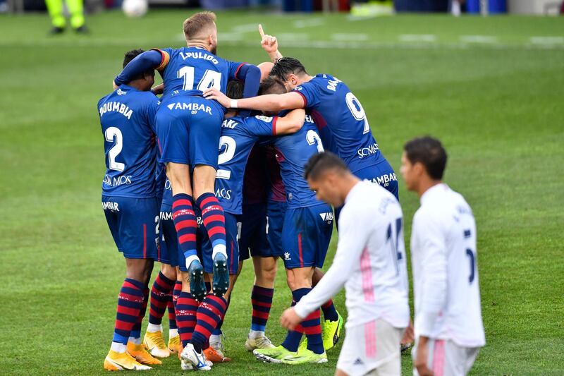 Huesca players celebrate after Javi Galan put them 1-0 up. AFP
