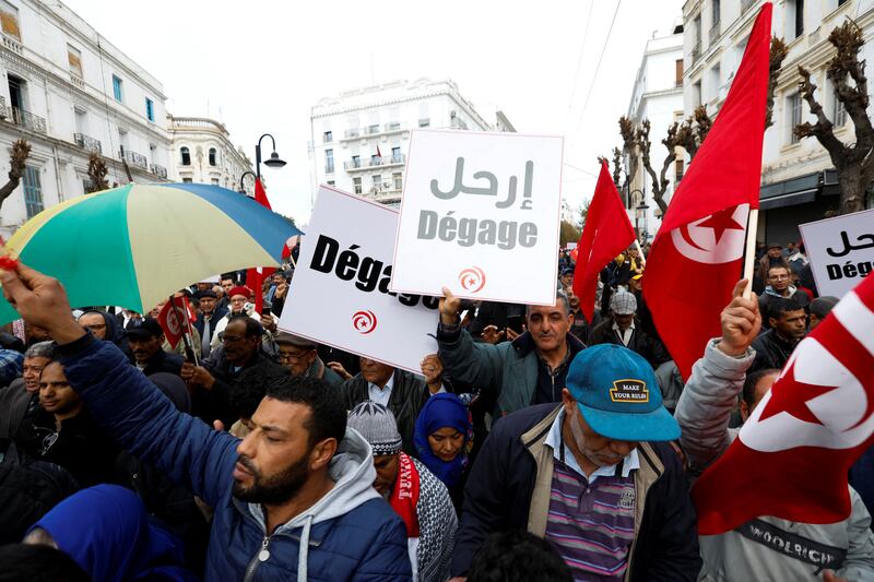 Supporters of opposition groups march in the Tunisian  capital, Tunis. Reuters