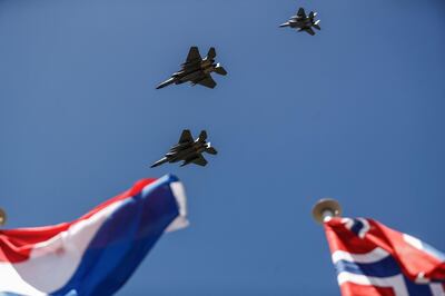 US Air Force F-15 fighter jets fly over  Vierville-sur-Mer, northwestern France, on June 6, 2020, as part of D-Day commemorations marking the 76th anniversary of the World War II Allied landings in Normandy.  For the first time in 75-years, official commemorations marking the 1944 D-Day landings, which marked the beginning of the end of Nazi Germany, have been canceled except for a limited gathering of representatives from nine countries for a short ceremony. Many of this year’s events will be relayed by live stream to the dwindling number of elderly former soldiers who took part in the allied landings along 80kms (50miles) of beaches. / AFP / Sameer Al-DOUMY
