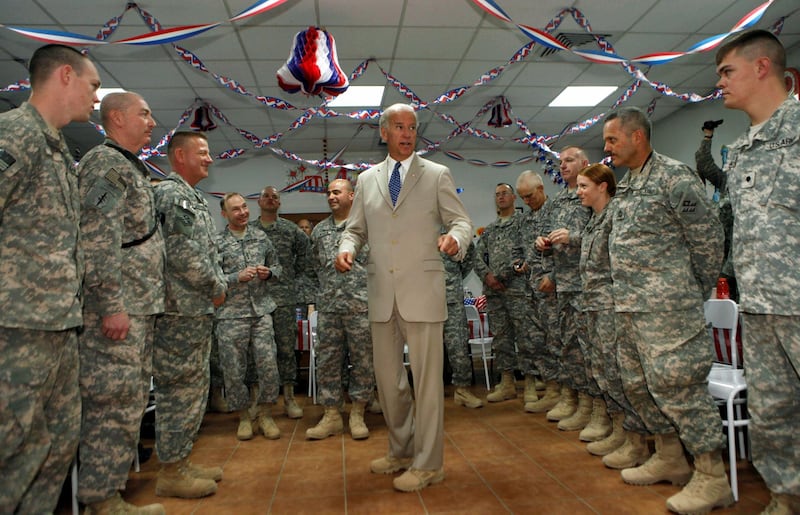 U.S. Vice President Joe Biden talks with soldiers at Camp Victory on the outskirts of Baghdad, Iraq July 4, 2009. Reuters