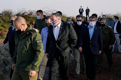 Secretary of State Mike Pompeo, center, arrives for a security briefing on Mount Bental in the Israeli-controlled Golan Heights, near the Israeli-Syrian border, Thursday, Nov. 19, 2020. (AP Photo/Patrick Semansky, Pool)