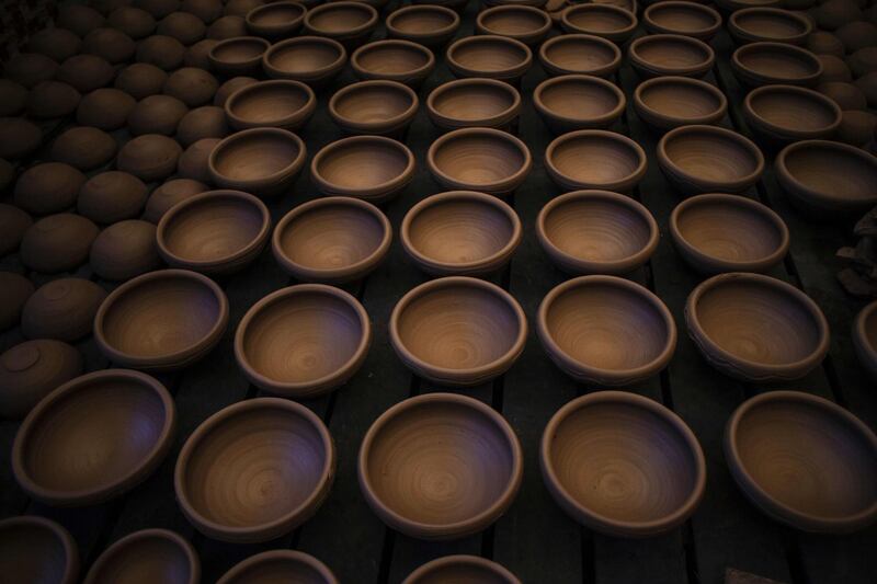 Clay bowls drying at Palestinian potter Sid Atallah's workshop in the central Gaza Strip. AFP