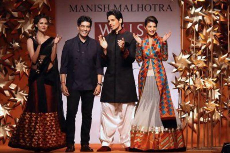 The Indian fashion designer Manish Malhotra, second from left, at Wills Lifestyle India Fashion Week in New Delhi. IANS