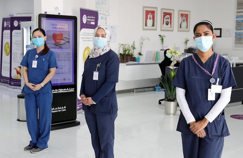 ABU DHABI, UNITED ARAB EMIRATES , May 11 – 2020 :- Left to Right-  Shane Simeon Galang from Philippines,  Mervat Aslan Mhgoub Mohamed from Egypt and Sowmya Kotian from India working as a nurse at the Bareen International Hospital in Mohammed bin Zayed City in Abu Dhabi. (Pawan Singh / The National) For News. Story by Nick Webster 
