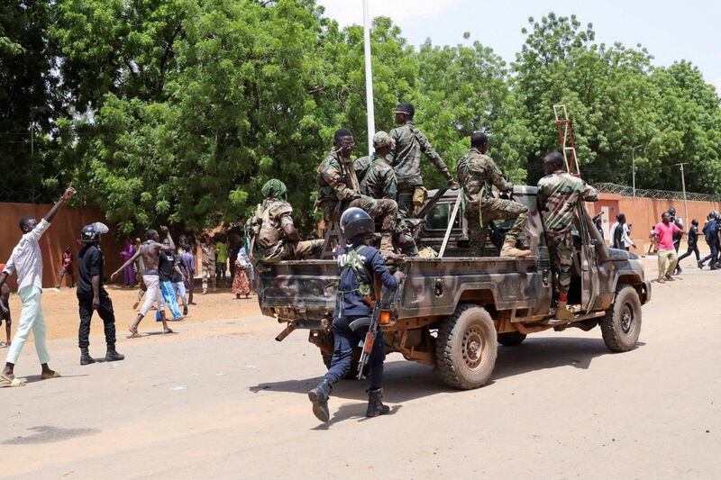 Nigerien security forces prepare to disperse pro-junta demonstrators gathered outside the French embassy in Niamey. Reuters