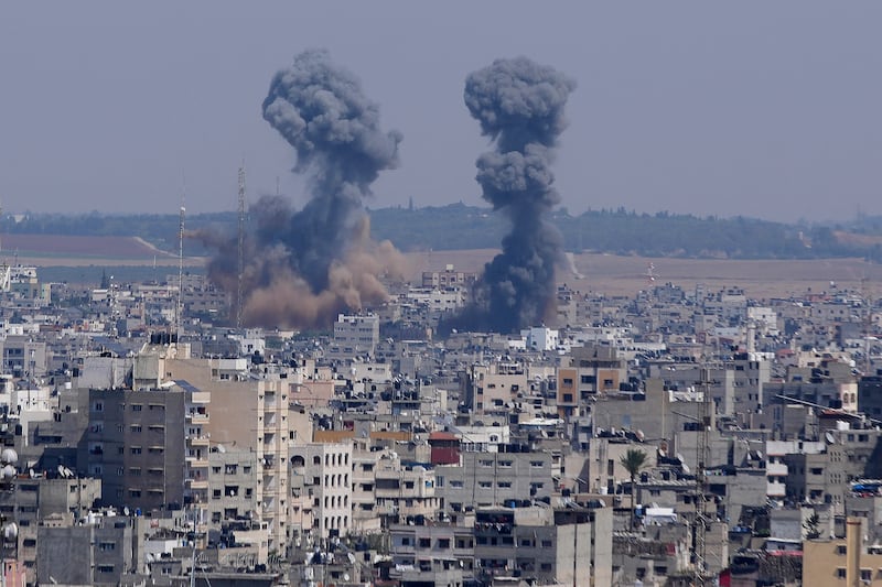 Smoke rises over the Gaza Strip following an Israeli air strike. AP