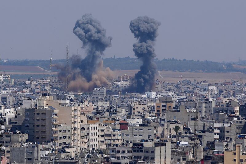 Smoke rises over the Gaza Strip following an Israeli air strike. AP