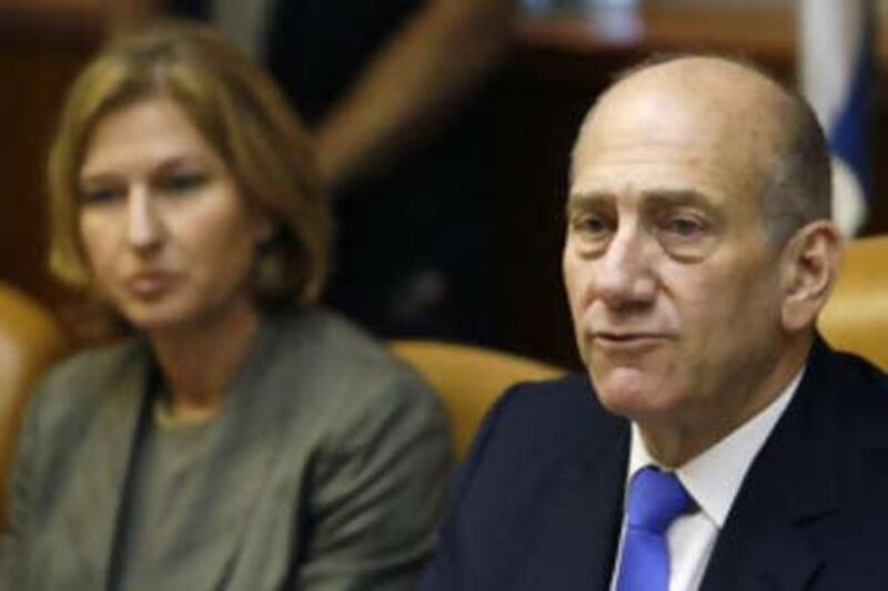 The Israeli prime minister Ehud Olmert, right, speaks as the foreign minister Tzipi Livni, left, looks on, during the weekly cabinet meeting at his Jerusalem office today.