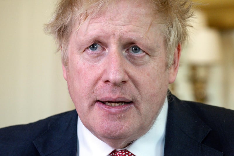 A handout image released by 10 Downing Street, shows Britain's Prime Minister Boris Johnson as he delivers a television address after returning to 10 Downing Street after being discharged from St Thomas' Hospital, in central London on April 12, 2020. - British Prime Minister Boris Johnson was discharged from hospital on Sunday, a Downing Street spokesman said, a week after being admitted for treatment for coronavirus and spending three days in intensive care. "The PM has been discharged from hospital to continue his recovery, at Chequers," the spokesman said, referring to the prime minister's country estate outside London. (Photo by Pippa FOWLES / 10 Downing Street / AFP) / RESTRICTED TO EDITORIAL USE - MANDATORY CREDIT "AFP PHOTO / 10 DOWNING STREET / PIPPA FOWLES" - NO MARKETING - NO ADVERTISING CAMPAIGNS - DISTRIBUTED AS A SERVICE TO CLIENTS