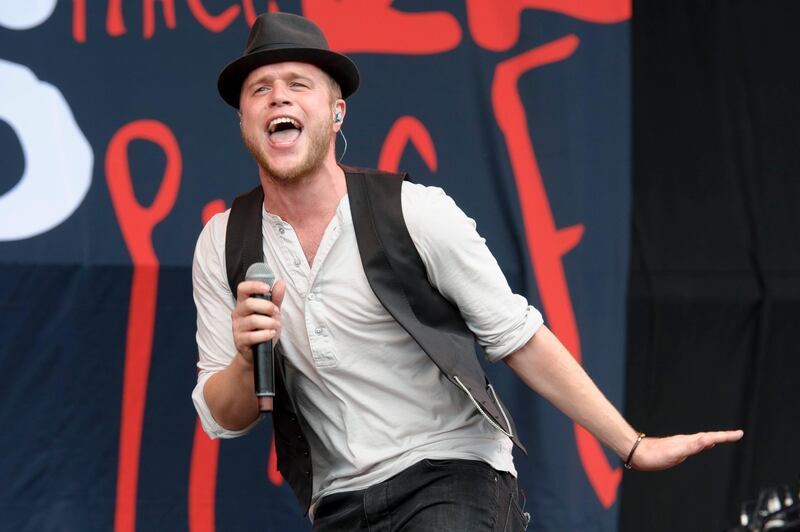 British singer Olly Murs performs at the V Festival in Chelmsford, England, Sunday, Aug. 18, 2013. (Photo by Jonathan Short/Invision/AP) *** Local Caption ***  Britain V Festival 2013 - Chelmsford Day 2.JPEG-0731a.jpg