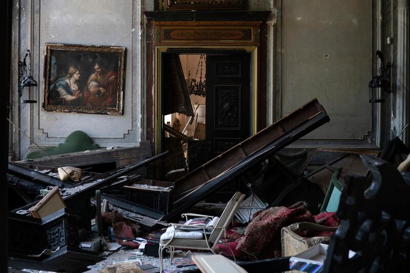 A painting hangs on the wall of a heavily damaged room in the Sursock Palace.  AP Photo