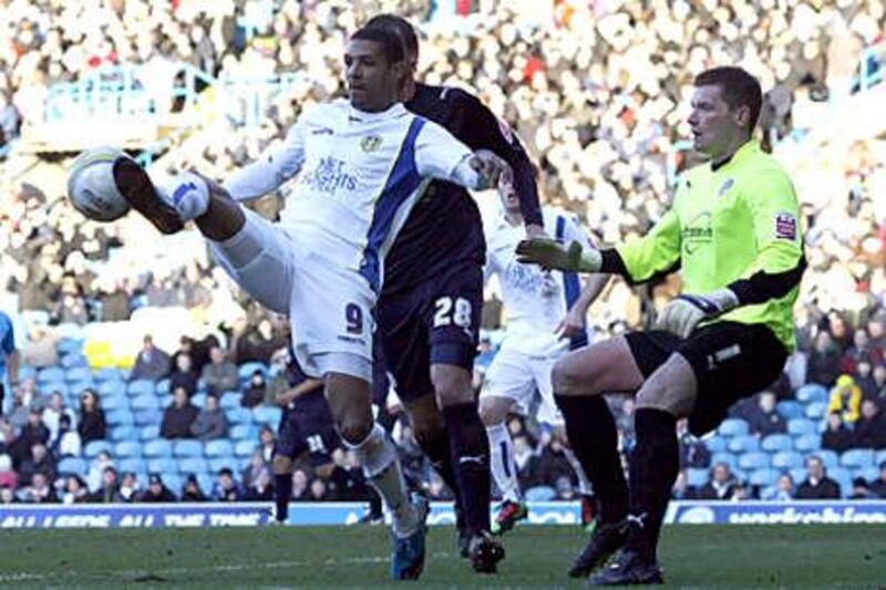 The striker Jermaine Beckford, in white, has joined Everton after helping Leeds secure promotion to the Championship.