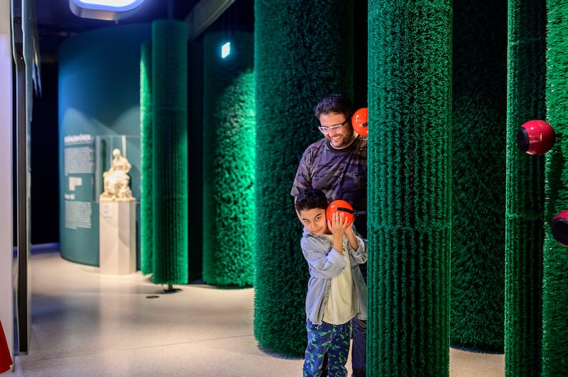 Visitors listen to the voices of the forest, which lead them into the maze of Sleeping Beauty’s thorn hedge at Grimmwelt Kassel. Photo: Grimmwelt Kassel