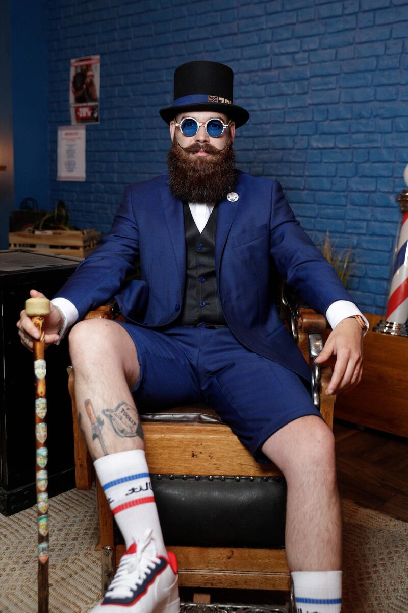 A contestant poses as he takes part in the third edition of the French Beard Championships in Paris. AFP