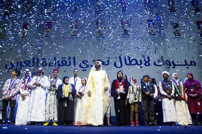 Sheikh Mohammed bin Rashid, Vice President and Ruler of Dubai, stands with the finalists of the Arab Reading Challenge during the closing awards ceremony at the Dubai Opera last year. Christopher Pike / The National
