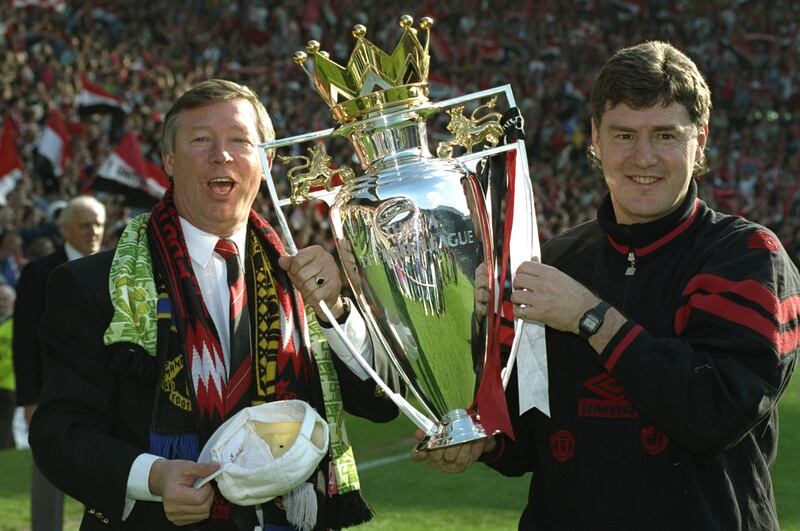 8 May 1994:  Manchester United Manager Alex Ferguson (left) and Assistant Manager Brian Kidd hold the Premiership trophy after the match against Coventry City at Old Trafford in Manchester, England. The match ended in a 0-0 draw. \ Mandatory Credit: ShaunBotterill/Allsport