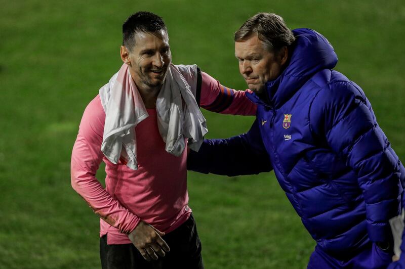 Barcelona's Lionel Messi, left, and manager Ronald Koeman celebrate after their win in the Copa del Rey against Rayo Vallecano. AP
