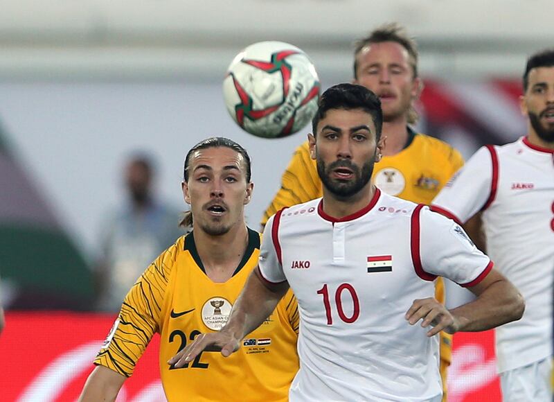 Osman, right, duels for the ball with Irvine. AP Photo