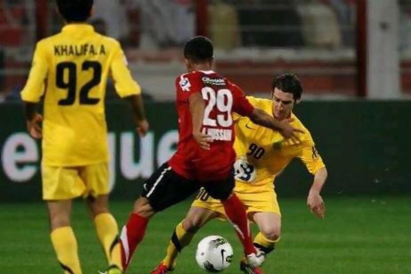 Al Wasl, in yellow, struggled to impose themselves against Al Ahli, and were undone by a goal from Faisal Khalil in the 61st minute that lifts Ahli into the Etisalat Cup final.