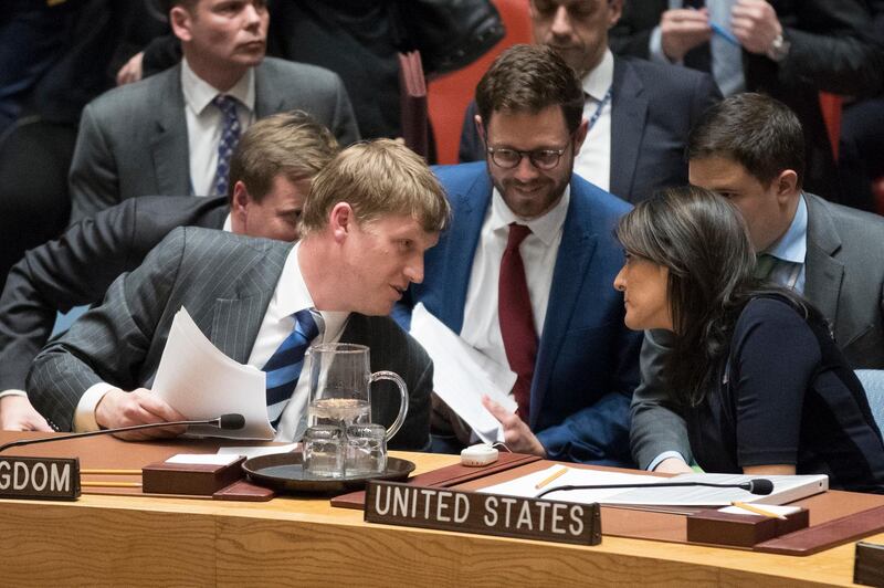 British Deputy Ambassador to the United Nations Jonathan Allen, left, speaks to U.S. Ambassador to the United Nations Nikki Haley at the end of a Security Council meeting on the situation between Britain and Russia, Wednesday, March 14, 2018 at United Nations headquarters. Britain said Wednesday it would expel 23 Russian diplomats and sever high-level bilateral contacts after Russia ignored a deadline to explain how a Soviet-developed nerve agent was used against ex-spy Sergei Skripal and his daughter Yulia. (AP Photo/Mary Altaffer)