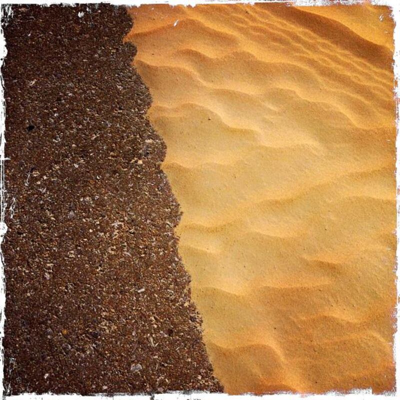 Day trip with friends to the Western Region and the Mazayin Dhafra Camel Festival, 220 kms west of Abu Dhabi on December 20, 2013.  Sand accumulation along side the road.  Picture taken with the Hipstamatic app for the iPhone. Liz Claus / The National