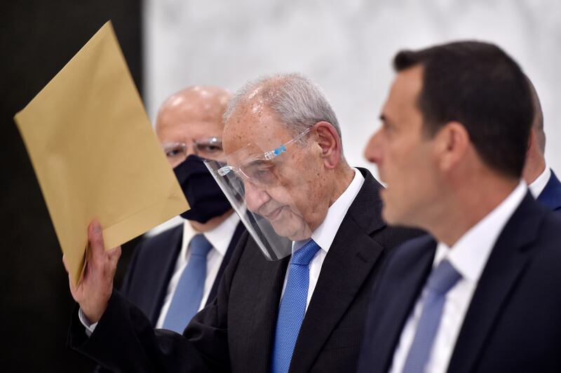 Speaker of the Lebanese Parliament Nabih Berri, centre, leaves the office of Lebanese President Michel Aoun after their meeting at the presidential palace in Baabda.