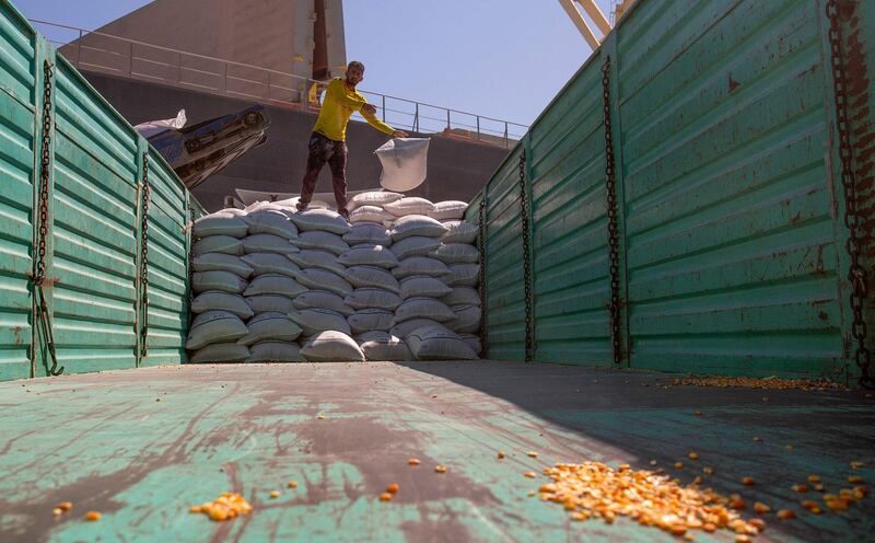 Bags of corn are stacked on the back of a lorry for transport out of the southern Iraqi port of Umm Qasr near Basra. AFP