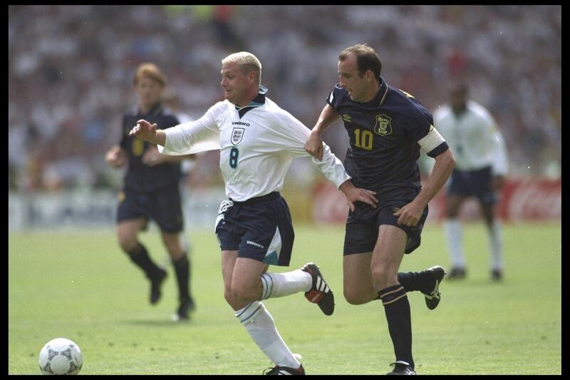 15 Jun 1996:   Paul Gascoigne of England is tackled by Gary McAllister of Scotland during the England v Scotland match in Group A of the European Football Championships at Wembley. England beat Scotland 2-0.