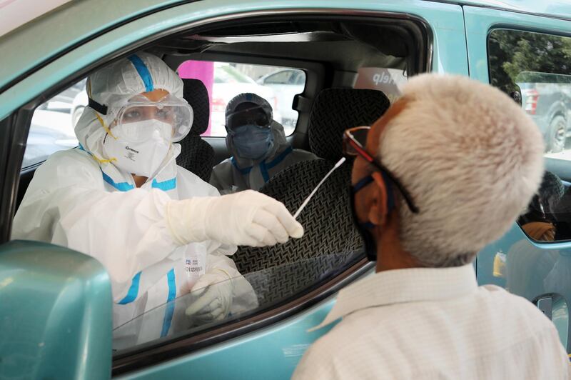 Health workers conduct a rapid-antigen methodology Covid-19 test from a testing vehicle at a healthcare centre in New Delhi, India. Bloomberg