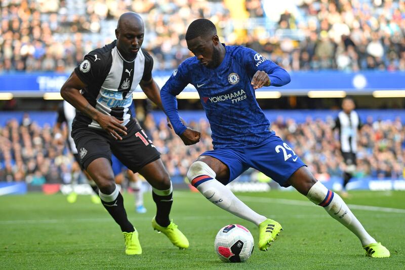 Newcastle United's Dutch defender Jetro Willems (L) vies with Chelsea's Canadian-born English defender Fikayo Tomori (R) during the English Premier League football match between Chelsea and Newcastle at Stamford Bridge in London on October 19, 2019. (Photo by Oliver GREENWOOD / AFP) / RESTRICTED TO EDITORIAL USE. No use with unauthorized audio, video, data, fixture lists, club/league logos or 'live' services. Online in-match use limited to 120 images. An additional 40 images may be used in extra time. No video emulation. Social media in-match use limited to 120 images. An additional 40 images may be used in extra time. No use in betting publications, games or single club/league/player publications. / 
